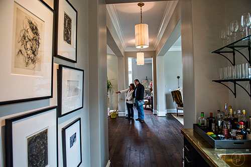 Jo McKeown (left) and Ed Davidson walk through the main floor of the 2015 Home for the Holidays Designer Showhouse located at 1150 West Garmon Rd. in Atlanta on Saturday, November 21, 2015. 