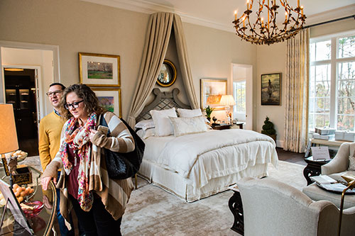 Jordan Johnson (right) and Freddie Miller walk throught the master suite inside the 2015 Home for the Holidays Designer Showhouse located at 1150 West Garmon Rd. in Atlanta on Saturday, November 21, 2015. 