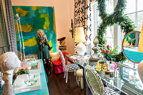 Rhoda Vickers takes a photo of one of the children's rooms inside the 2015 Home for the Holidays Designer Showhouse located at 1150 West Garmon Rd. in Atlanta on Saturday, November 21, 2015. 