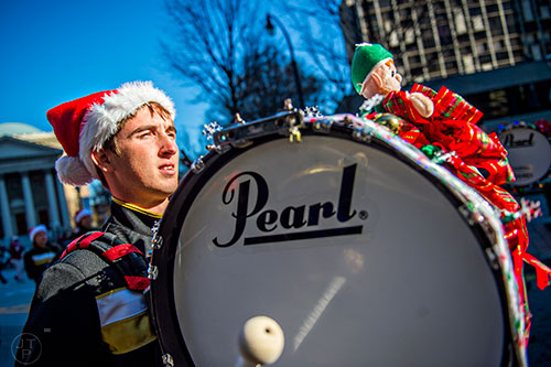 Maddison Presnal plays the bass drum as he marches in the 2015 Children's Christmas Parade in Atlanta on Saturday, December 5, 2015. 