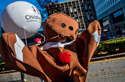 Dressed as a gingerbread cookie, Spicer Lear marches in the 2015 Children's Christmas Parade in Atlanta on Saturday, December 5, 2015. 