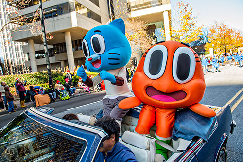 Cartoon Network characters Darwin and Gumball wave to the crowd during the 2015 Children's Christmas Parade in Atlanta on Saturday, December 5, 2015. 
