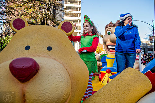 Caroline Evans (left) and her mother Katherine wave to the crowd during the 2015 Children's Christmas Parade in Atlanta on Saturday, December 5, 2015. 