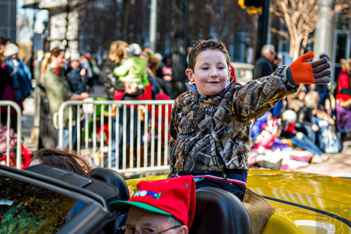 Charles Durden waves to the crowd during the 2015 Children's Christmas Parade in Atlanta on Saturday, December 5, 2015. 