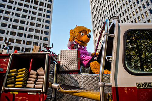 The Berenstain Bears ride a fire engine during the 2015 Children's Christmas Parade in Atlanta on Saturday, December 5, 2015. 