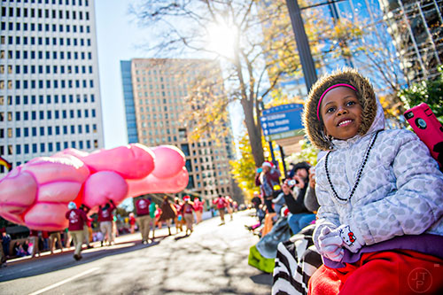 Riley Braithwaite (right) watches the 2015 Children's Christmas Parade in Atlanta on Saturday, December 5, 2015. 