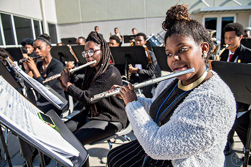 Gabrielle Latimore (right) and Barbara Walcot-Ceesay perform with the rest of the Southwest Dekalb High School Wind Symphony during the 74th anniversary of Pearl Harbor ceremony at the DeKalb County School District Administrative and Instructional Complex in Stone Mountain on Monday, December 7, 2015.