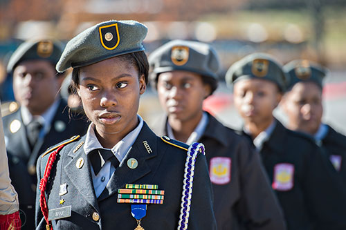 Ajai Bogle with the Miller Grove High School Army JROTC stands with her unit during the 74th anniversary of Pearl Harbor ceremony at the DeKalb County School District Administrative and Instructional Complex in Stone Mountain on Monday, December 7, 2015.   
