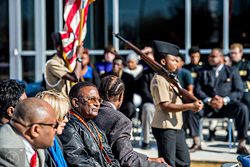 Lloyd Leach (center) watches as the color guard proceeds into the 74th anniversary of Pearl Harbor ceremony at the DeKalb County School District Administrative and Instructional Complex in Stone Mountain on Monday, December 7, 2015. 