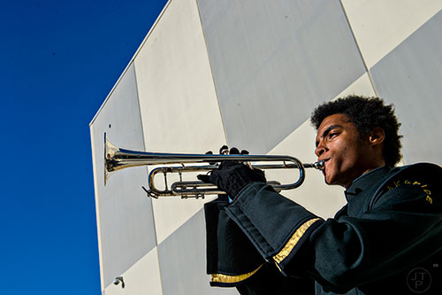 Lakeside High School's Timothy Trumpet plays taps during the 74th anniversary of Pearl Harbor ceremony at the DeKalb County School District Administrative and Instructional Complex in Stone Mountain on Monday, December 7, 2015. 