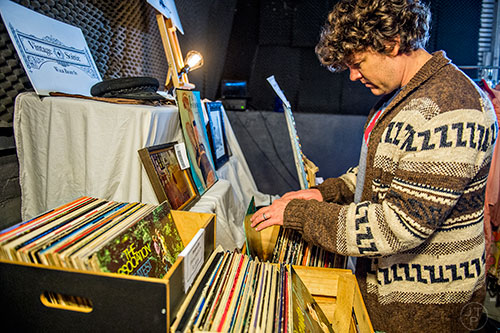 Steven Salkeld looks through a crate of vinyl records during the Bazaar on the Beltline at The Hanger off of the Eastside Trail in Atlanta on Saturday, December 12, 2015. 