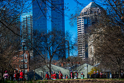 Thousands of people in their ugliest holiday themed gear make their way through Piedmont Park in Atlanta during the Ugly Sweater Run on Saturday, December 19, 2015.  