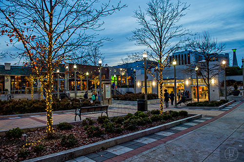 Lights wrap around the trees at the entrance to the Decatur MARTA station.