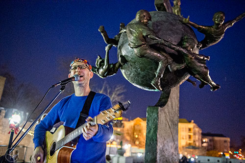 Michael Levine sings to the crowd during the Chanukah celebration in Decatur Square on Thursday.