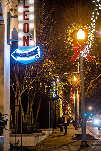 Wreaths and holiday lights decorate the light poles near Leon's on E. Ponce de Leon Ave in Decatur.