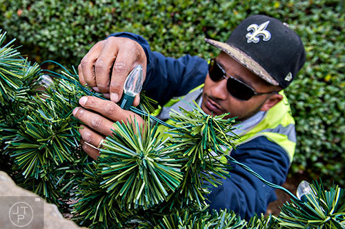 The city of Peachtree Corners' public works department sets up the Christmas decorations for the season on Wednesday, November 25, 2015.