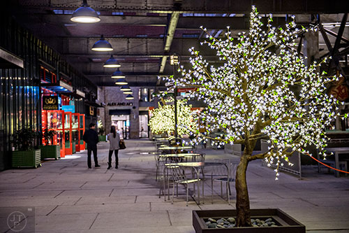 Snowflake lights adorn the trees outside of Ponce City Market.