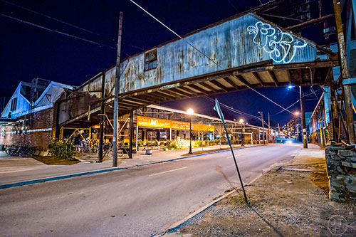 The Bridge to Nowhere crosses over Krog St. at the front of Krog St. Market home to the Ticonderoga Club.