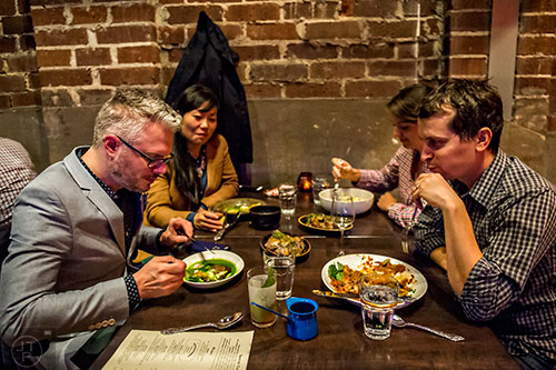 Enjoying a meal with friends at Ticonderoga Club inside Krog St. Market on Friday.