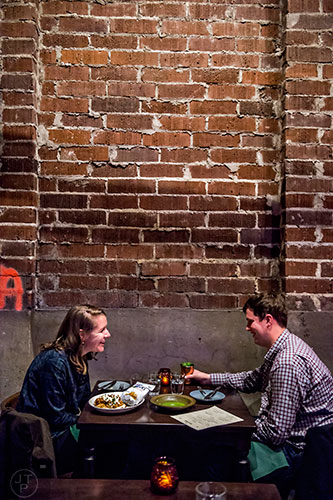 A quiet corner for two in the main dining area at Ticonderoga Club inside Krog St. Market on Friday.