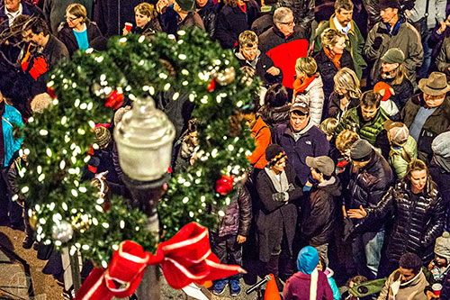 More than a thousand people fill the lot in front of Brick Store and Little Shop of Stories in downtown Decatur for the annual tree lighting on Thursday.