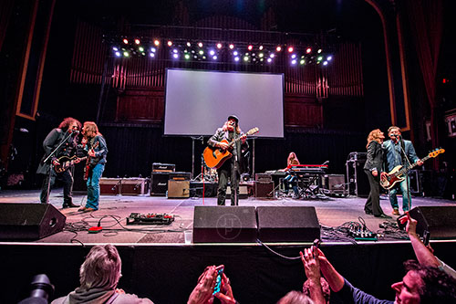 Rick Richards (left), Charlie Starr, Kevn Kinney, Brandon Still, Michelle Malone and Tim Nielsen perform on stage during a tribute to the late Alex Cooley at the Tabernacle in Atlanta on Saturday, January 9, 2016. 
