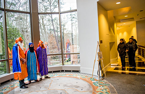 Will Miller (left), William Foshee and Bennett Porson greet people as they enter the Dia de los Reyes, or Three Kings Day, celebration at the Atlanta History Center on Sunday, January 10, 2016.    