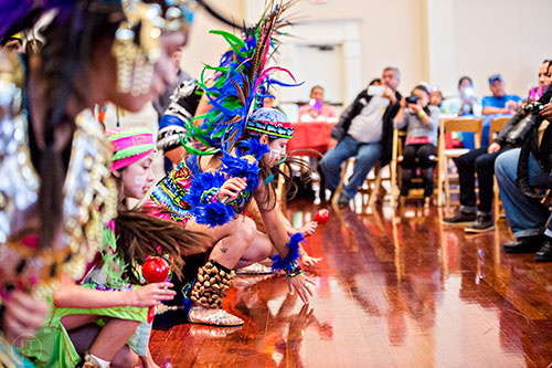 Iliayalit Trejo (center) performs a traditional Aztec dance during the Dia de los Reyes, or Three Kings Day, celebration at the Atlanta History Center on Sunday, January 10, 2016.  