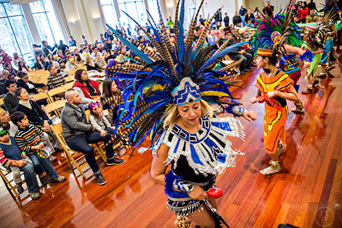 Guera Azteca (center) spins as she performs a traditional Aztec dance during the Dia de los Reyes, or Three Kings Day, celebration at the Atlanta History Center on Sunday, January 10, 2016. 