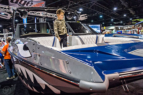 Will Rogers checks out the bow of a Tige RZX during the 54th annual Atlanta Boat Show at the Georgia World Congress Center in Atlanta on Saturday, January 16, 2016. 