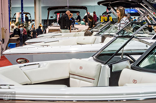 Missy Jones (right) looks at one of the many boats on display during the 54th annual Atlanta Boat Show at the Georgia World Congress Center in Atlanta on Saturday, January 16, 2016. 