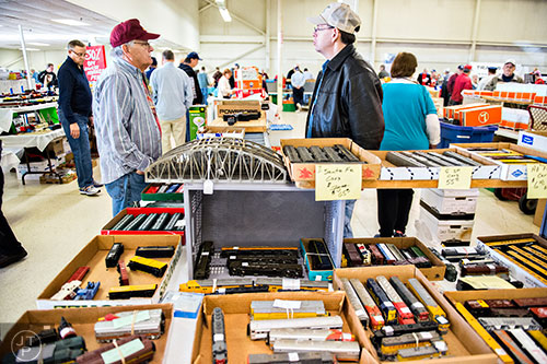 Toby Antinore (left) talks with Kevin Wood at his booth during the 50th annual Atlanta Model Train And Railroadiana Show And Sale at the North Atlanta Trade Center in Norcross on Saturday, January 16, 2016.    