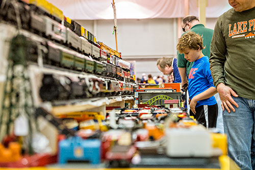 Dylan Gilbert looks at train sets for sale during the 50th annual Atlanta Model Train And Railroadiana Show And Sale at the North Atlanta Trade Center in Norcross on Saturday, January 16, 2016. 