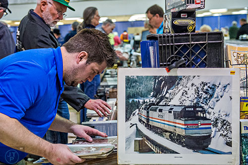 Justin Strickland looks at old issues of L&N  Magazine during the  50th annual Atlanta Model Train And Railroadiana Show And Sale at the North Atlanta Trade Center in Norcross on Saturday, January 16, 2016. 
