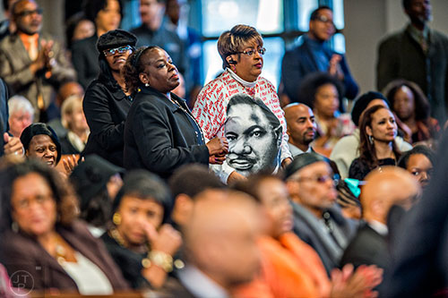 Gail Hollin (right) and Anita Johnson wait for the start of the 48th Martin Luther King Jr. Annual Commemorative Service at Ebenezer Baptist Church in Atlanta on Monday, January 18, 2016.