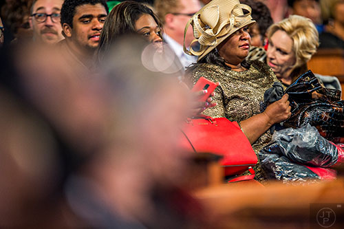 Rebecca Barber (right) waits for the start of the 48th Martin Luther King Jr. Annual Commemorative Service at Ebenezer Baptist Church in Atlanta on Monday, January 18, 2016. 