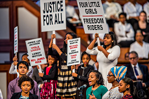 Farris Christine Watkins (bottom right at microphone), the great niece of Dr. Martin Luther King Jr., gives a performance of his speech at the Chicago Freedom Movement Rally with students from Atlanta area high schools and colleges  during the 48th Martin Luther King Jr. Annual Commemorative Service at Ebenezer Baptist Church in Atlanta on Monday, January 18, 2016. 