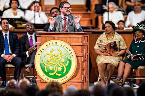 Pastor Eugene Cho (left) speaks during the 48th Martin Luther King Jr. Annual Commemorative Service at Ebenezer Baptist Church in Atlanta on Monday, January 18, 2016. 
