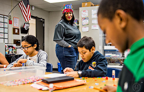 Kam Payne (center) teaches her fifth grade advanced math class at Centerville Elementary School in Snellville on Friday, January 22, 2016. Gov. Nathan Deal recently referenced in his state of the state address Gwinnett's school system as one of the first in Georgia to implement a teacher compensation system based on merit -- pay teachers based on how well students perform on standardized tests and other academic measures.   JONATHAN PHILLIPS / SPECIAL