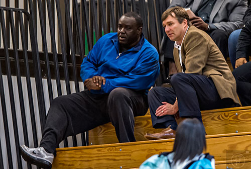 University of Georgia's new head coach Kirby Smart (right) talks to Derrick Brown's father James as they watch him play during the Lanier basketball game against Gainesville on Thursday, January 28, 2016. 