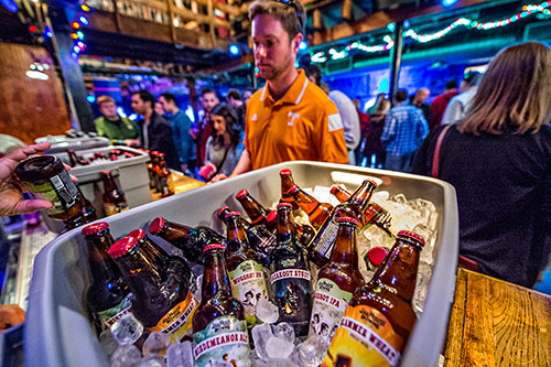 Bottles of Jailhouse Brewery beers sit on ice as Sean Shapiro comes up to the bar for a sample during the Atlanta Winter Beer Fest at The Masquerade in Atlanta on Saturday, January 30, 2016. 