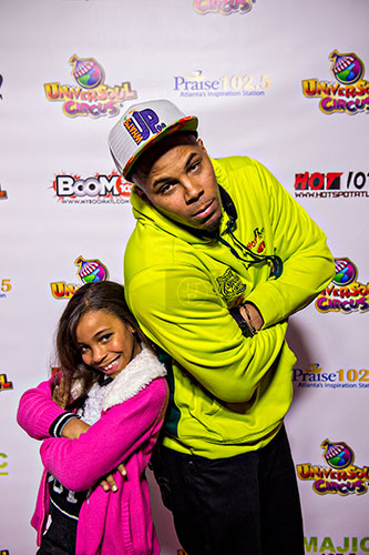 Hot 107.9's Reec Swiney (right) walks the red carpet with his daughter Malana before the opening night of the UniverSoul Circus in Atlanta on Wednesday, February 3, 2016.   