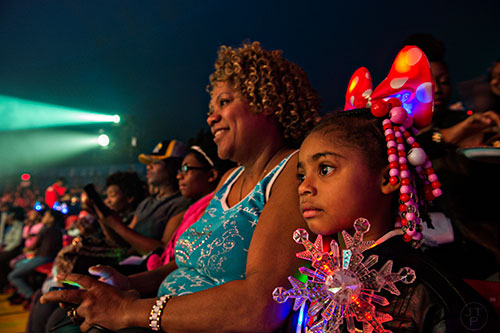Aareal Flowers (right) and her grandmother Leticia watch the different acts perform during the opening night of the UniverSoul Circus in Atlanta on Wednesday, February 3, 2016.  
