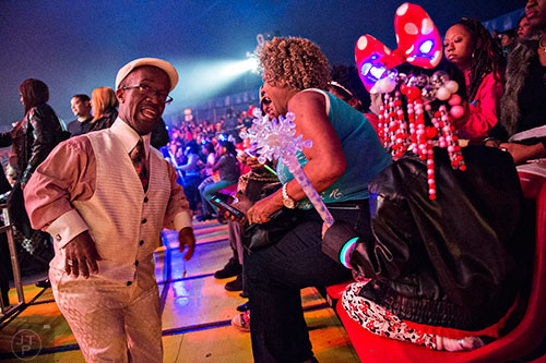 Zeke the Sidekick (left) makes his way through the crowd during the opening night of the UniverSoul Circus in Atlanta on Wednesday, February 3, 2016.