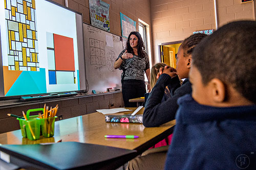 Brooke Malone teaches her students using example of paintings by artist Piet Mondrian during a math lab at Powder Springs Elementary School in Powder Springs on Thursday, January 28, 2016. 