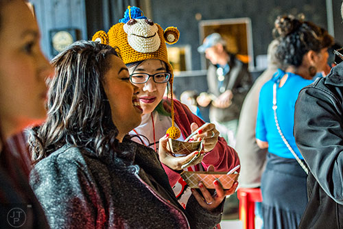 Nancy Chen (center) talks to Erin Barbee as they eat during the Lunar New Year Celebration at Makan in Decatur on Saturday, February 6, 2016. 
