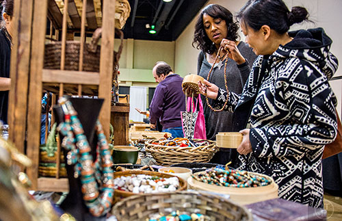 Cindy Nguyen (right) and Kathy Bruster check out the different beads for sale during the Intergalactic Bead Show at the Infinite Energy Center in Duluth on Saturday, February 6, 2016. 
