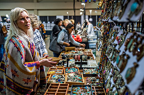 Michelle Redmond (left) checks out the different beads for sale during the Intergalactic Bead Show at the Infinite Energy Center in Duluth on Saturday, February 6, 2016.