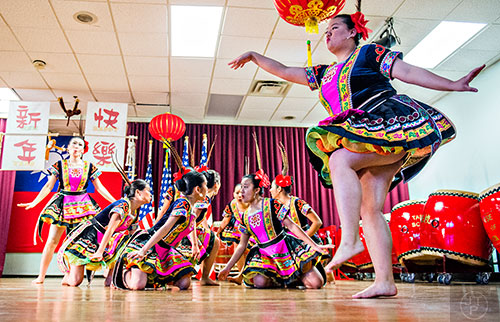 Laura Brockmann (right) dances with the Atlanta Chinese Dance Company during the Atlanta Chinese Lunar New Year Festival in Chamblee on Saturday, February 13, 2016. 