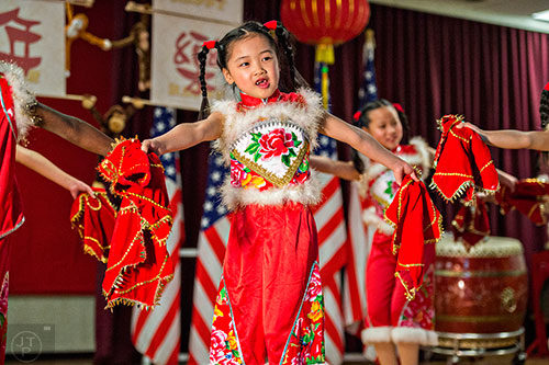 Anya Chung (center) performs on stage during the Atlanta Chinese Lunar New Year Festival in Chamblee on Saturday, February 13, 2016. 